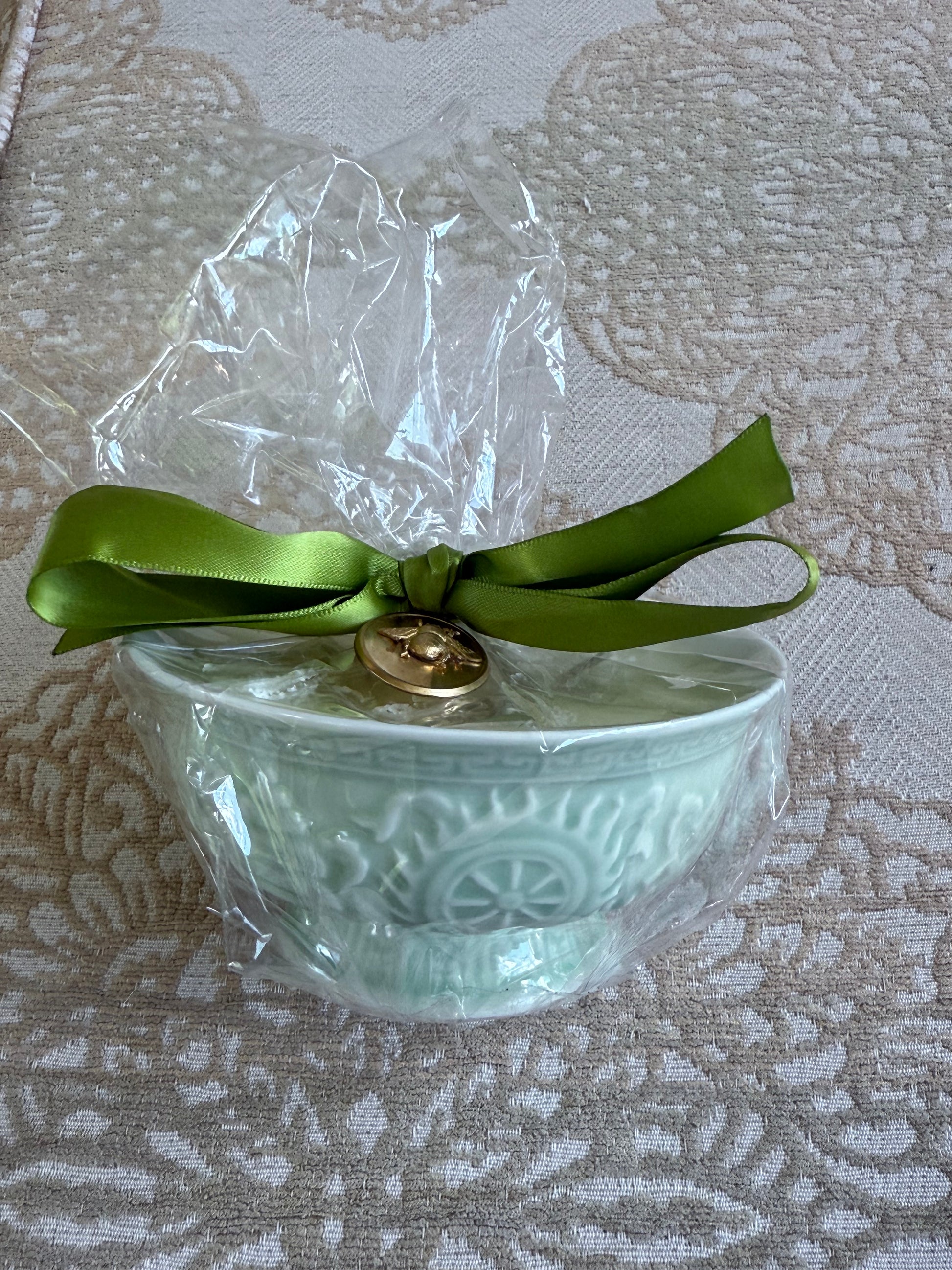 French Bee Candles decorative ceramic bowl, wrapped in clear plastic with green satin ribbon and gold tag; available in multiple sizes.