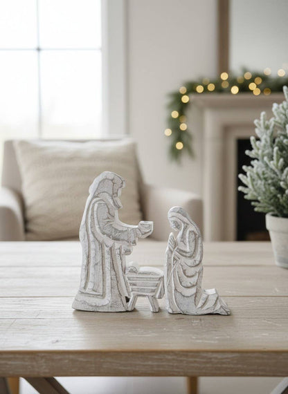 Nativity Trio figurine, 6.5x8in, features Mary, Joseph, and baby Jesus in a white finish.