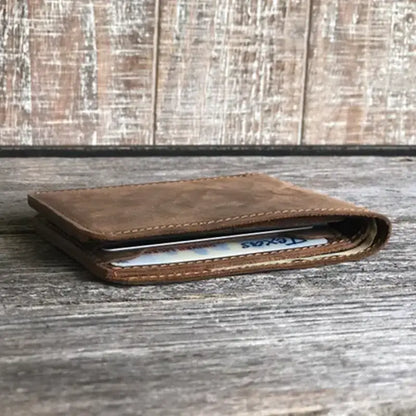 Rustic brown genuine leather bifold wallet, handmade for men, shown closed with a card partly visible; available in all sizes.