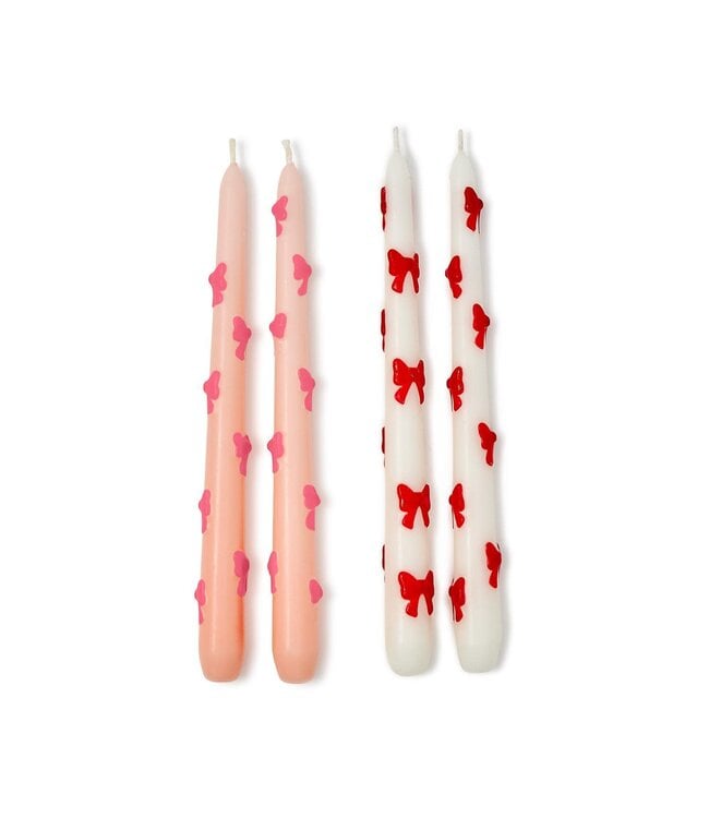 Set of 2 Bow Taper Candles: one light pink with pink bow, one white with red bow. Gift boxed. Sizes available: standard taper.