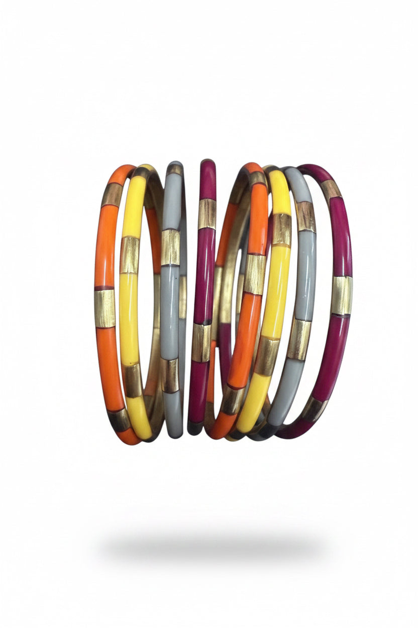 Set of six bangles from The Autumn Veda Stack by BuDhaGirl, with orange, yellow, grey, and magenta sections separated by gold bands. Available in small, medium, and large sizes.