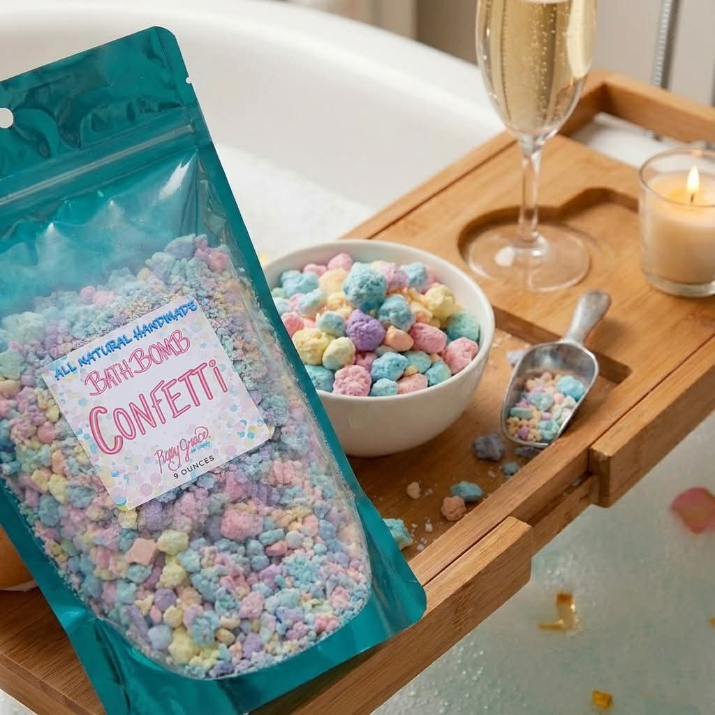 Bath Bomb Confetti pouch on bath tray with colorful confetti pieces in bowl and scoop. Available in 8oz and 16oz sizes.