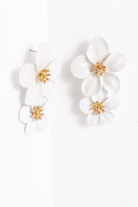 The Belle Floral Drop Earrings: Orchid have three layered white orchid blooms with gold centers; available in one size.