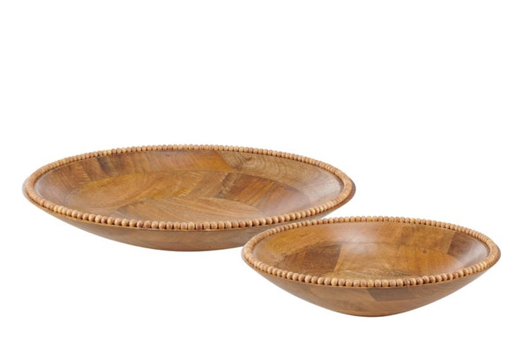 Set of two round mango wood serving bowls with beaded rims, smooth finish; available in two sizes.