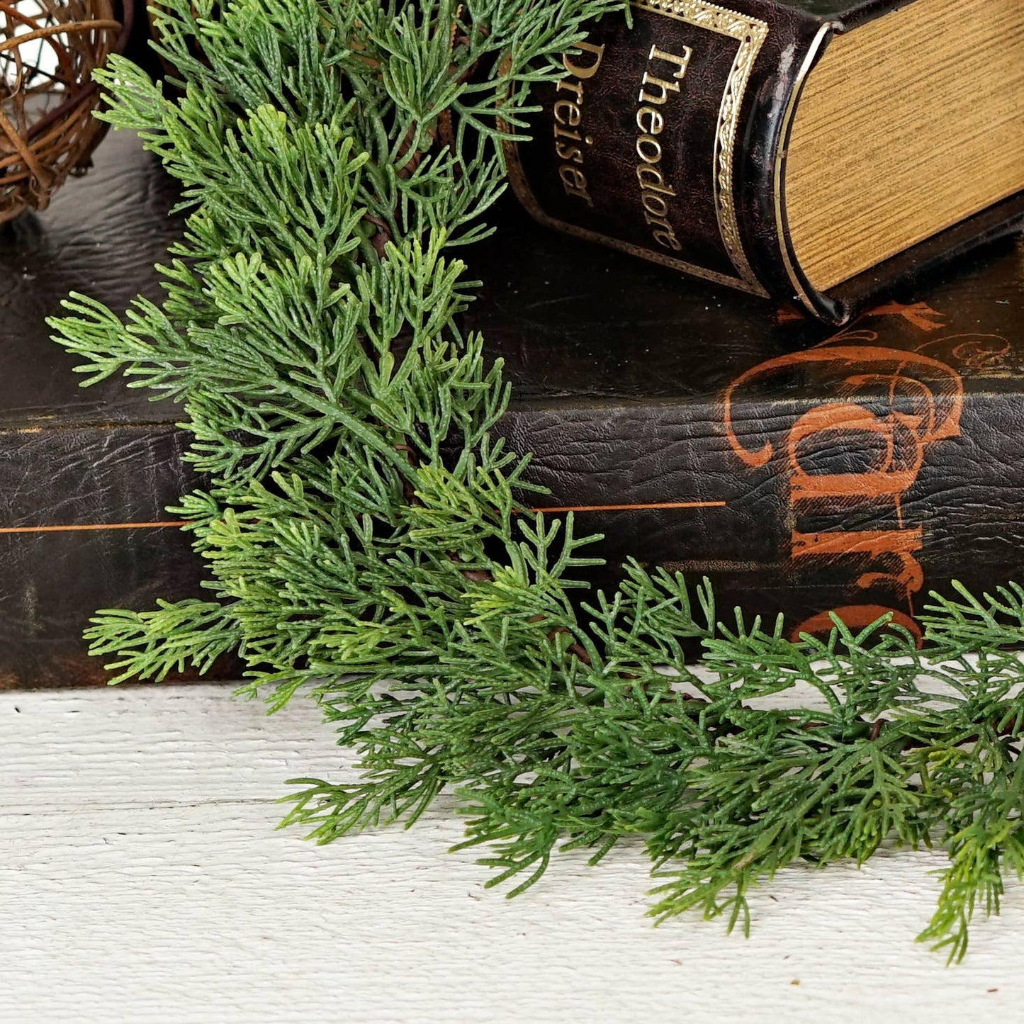 Evergreen soft touch cedar branches from the 14-inch Plate Charger. Available size: 14 inches.