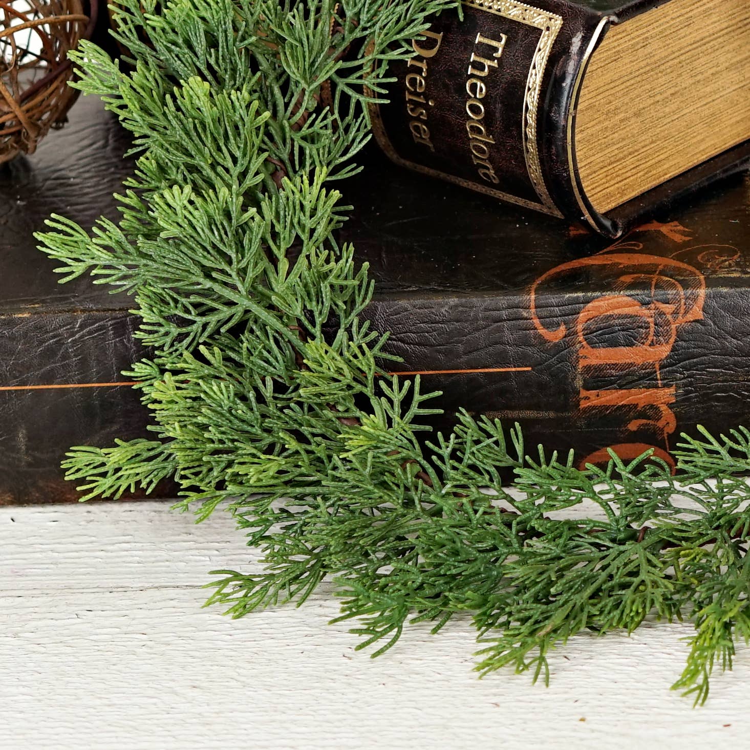 Evergreen soft touch cedar branches from the 14-inch Plate Charger. Available size: 14 inches.