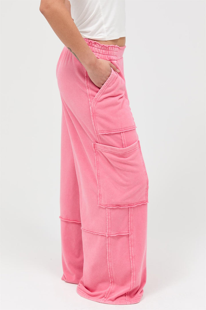 Pink Mineral Wash Wide Leg Cargo Pants with high-rise fit, large side pockets, visible seams. Sizes: XS-XL.
