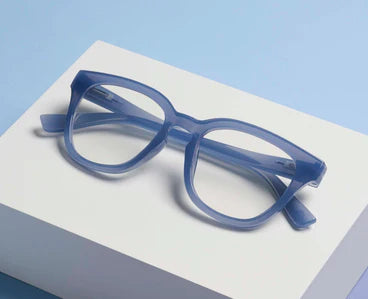 Peepers Progressives - Nola Denim: clear blue thick-framed eyeglasses, available in multiple sizes, compatible with progressive lenses.