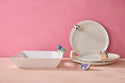 The Celebration Circle Plate: white stoneware, stacked round dishes with rectangular bowl. Available in S, M, L sizes.