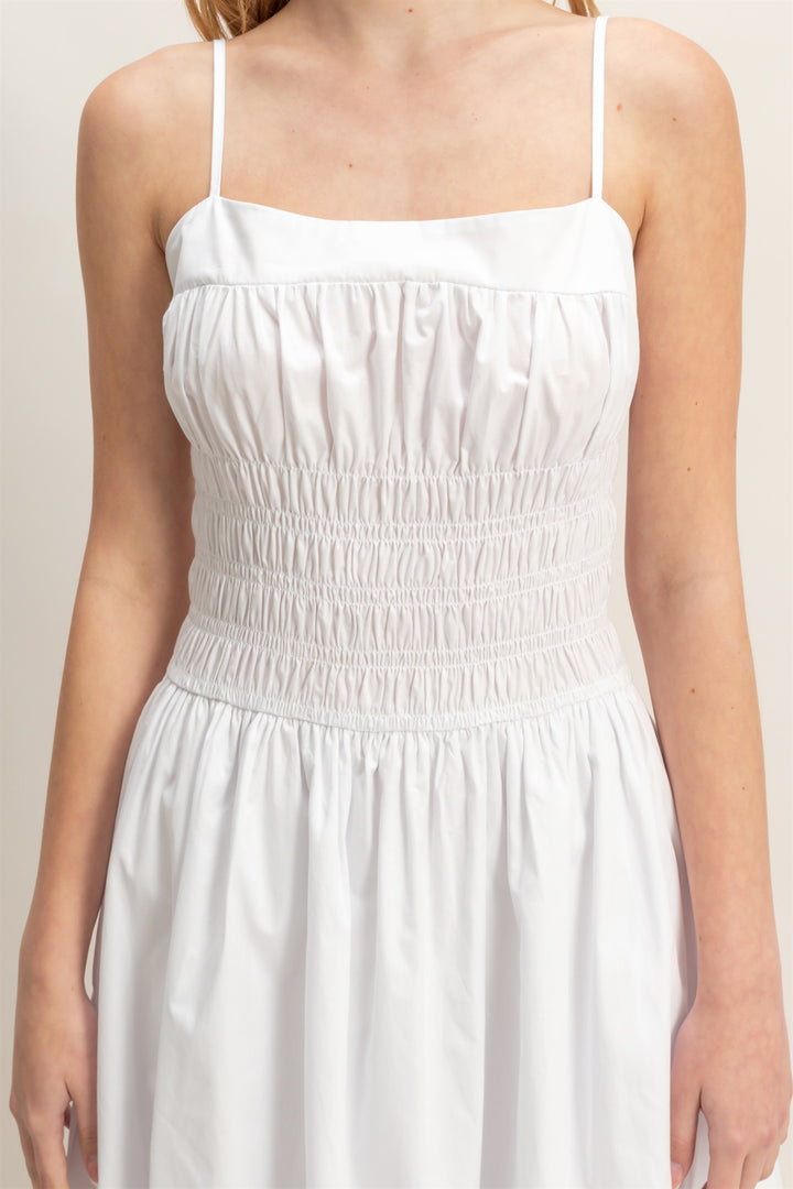 White Smocked Strapped Midi Dress with thin straps, gathered bodice, smocked waist; available in 2 colors and multiple sizes.