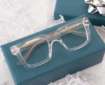 Peepers Progressives - Spotlight eyeglasses with a clear rectangular frame, gold arms, and advanced blue light technology. Sizes available: small, medium, large.