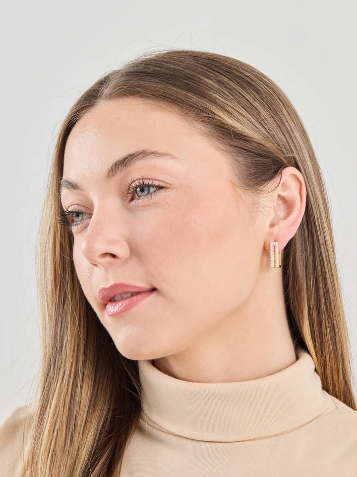 Delany 18k Gold Plated Earrings, available in S/M/L. Simple gold hoop design with polished finish.