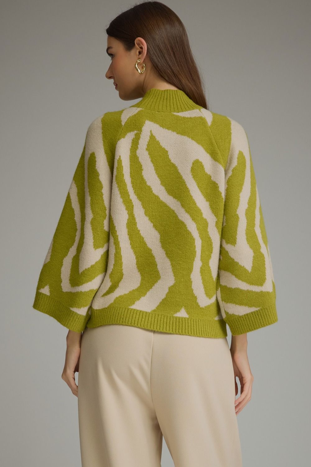 Chartreuse and cream zebra print mock neck sweater with three-quarter length sleeves. Available in all sizes.
