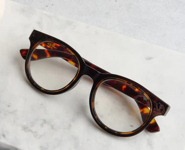 Peepers Olympia tortoiseshell blue light glasses with round lenses. Available in small, medium, and large sizes.