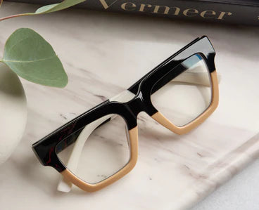 Peepers - Take a Bow square frames in black and tan with bold accents; available in multiple sizes.