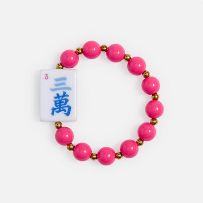 Mahjong Beaded Stretch Bracelet with pink and gold beads, a white tile with blue Japanese kanji and a pink number 3, plus colorful acrylic accents. Sizes available: S, M, L.