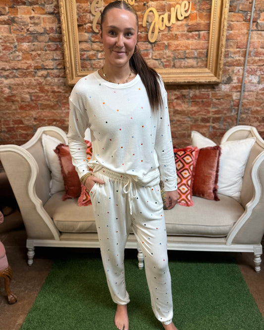 Sophie Confetti Dot Jogger Set: white jogger set with multicolor confetti dots, available in sizes XS–XL.