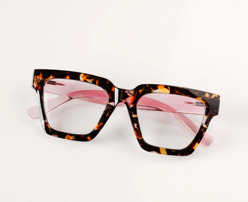Peepers Progressives - Take a Bow Pink Botanico/Pink eyeglasses with thick square-shaped tortoiseshell frames, pink-tinted temples, and clear lenses. Blue light lenses optional. Available in multiple sizes.