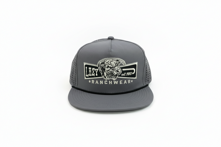 Gray flat-brim trucker hat with mesh back, embroidered steer head patch. Available sizes: S, M, L, XL.