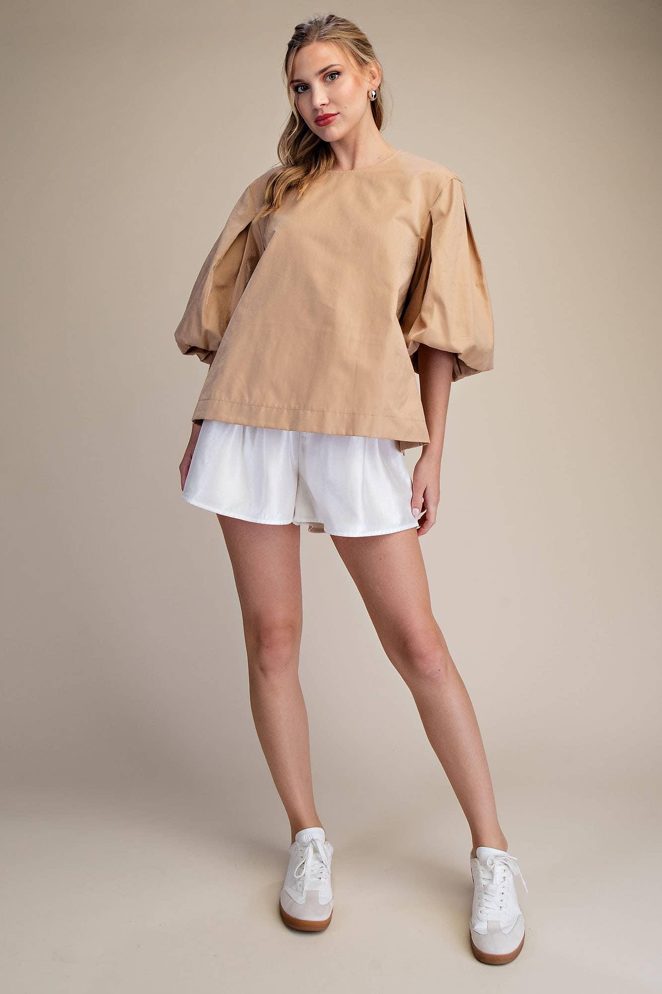 Taupe Round Neck Voluminous Puff Sleeve Top available in sizes XS-XL; features dramatic sleeves and classic round neckline.