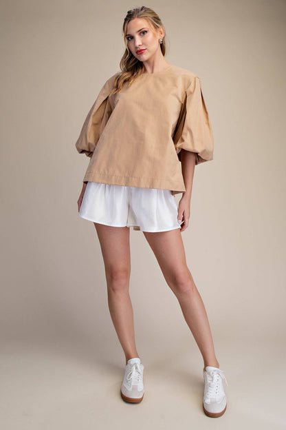 Taupe Round Neck Voluminous Puff Sleeve Top available in sizes XS-XL; features dramatic sleeves and classic round neckline.