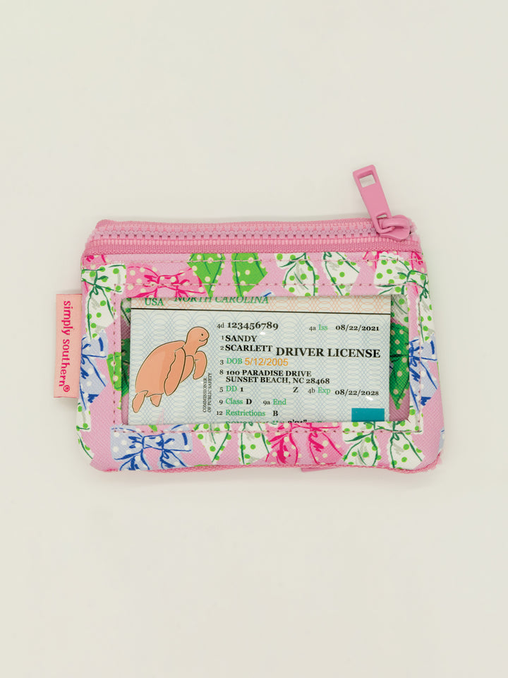 Small zippered key chain wallet with clear window, pink/blue/green leaf print on white. Available in one compact size.