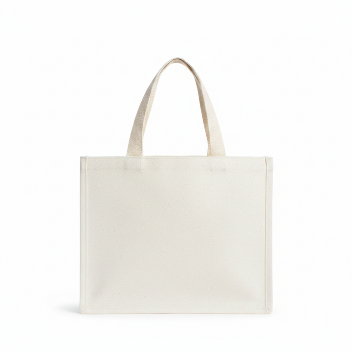 We Wish You Gift Tote, an off-white canvas bag with two top handles.
