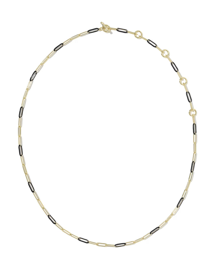 The Courtney Enamel Link Necklace by Kendra Scott features alternating black and gold elongated links, five gold rings on one side, and a toggle clasp; available in 18-inch length.