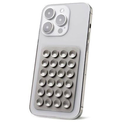 Adhesive phone mount with metallic grid of raised circular buttons; available in small, medium, and large sizes.