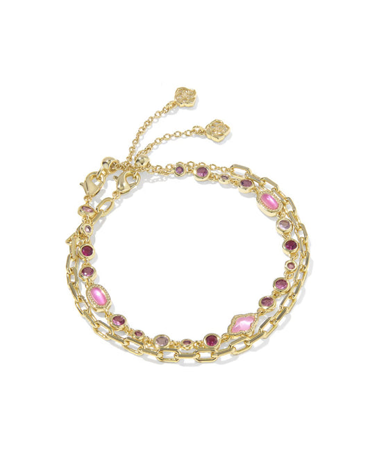 Set of 2 gold chain bracelets with pink and purple gemstones, adjustable clasps, two charms, and a pink crystal. Sizes vary.