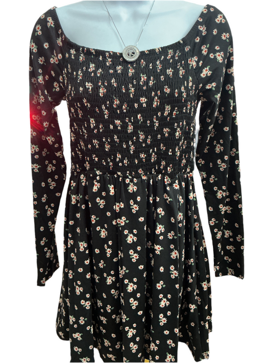 Black floral print dress by White Birch, square neckline, shirred bodice, long sleeves. Built-in shorts. Sizes S-XL.