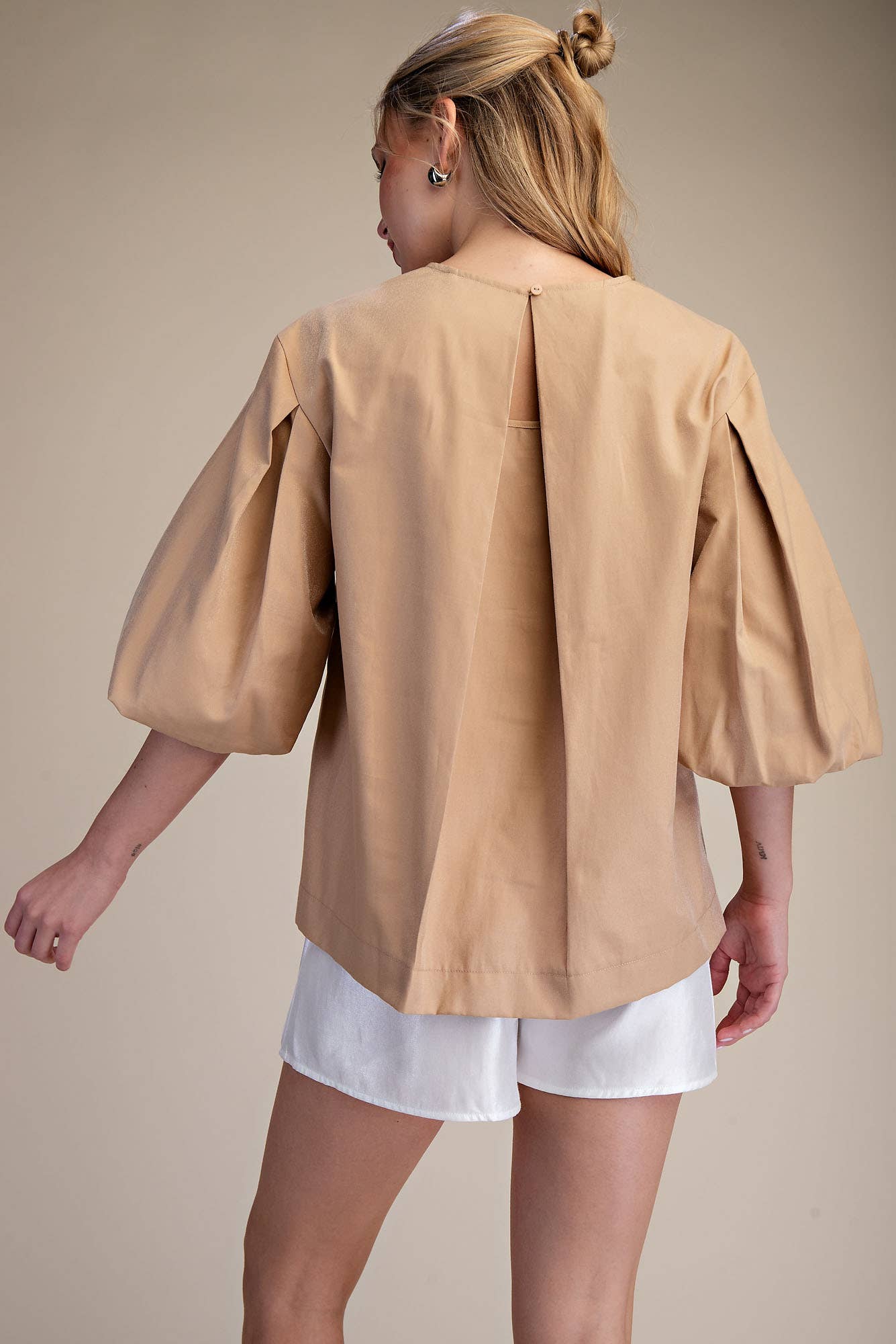 Taupe Round Neck Voluminous Puff Sleeve Top with pleated detail, back button closure. Sizes XS-XL. Lightweight, stylish.