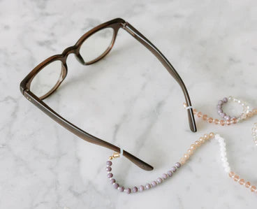 Peepers - Kitt brown eyeglasses with lightweight frames and a beaded chain featuring purple, pink, and white beads. Available sizes: small, medium, large.