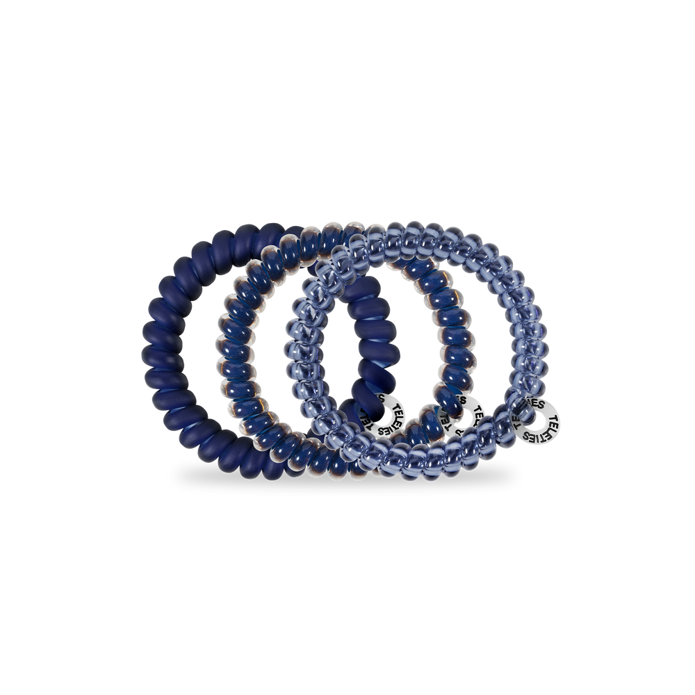 Set of four small spiral hair coils—three navy, one translucent blue, all with silver tags. Available in size Small.