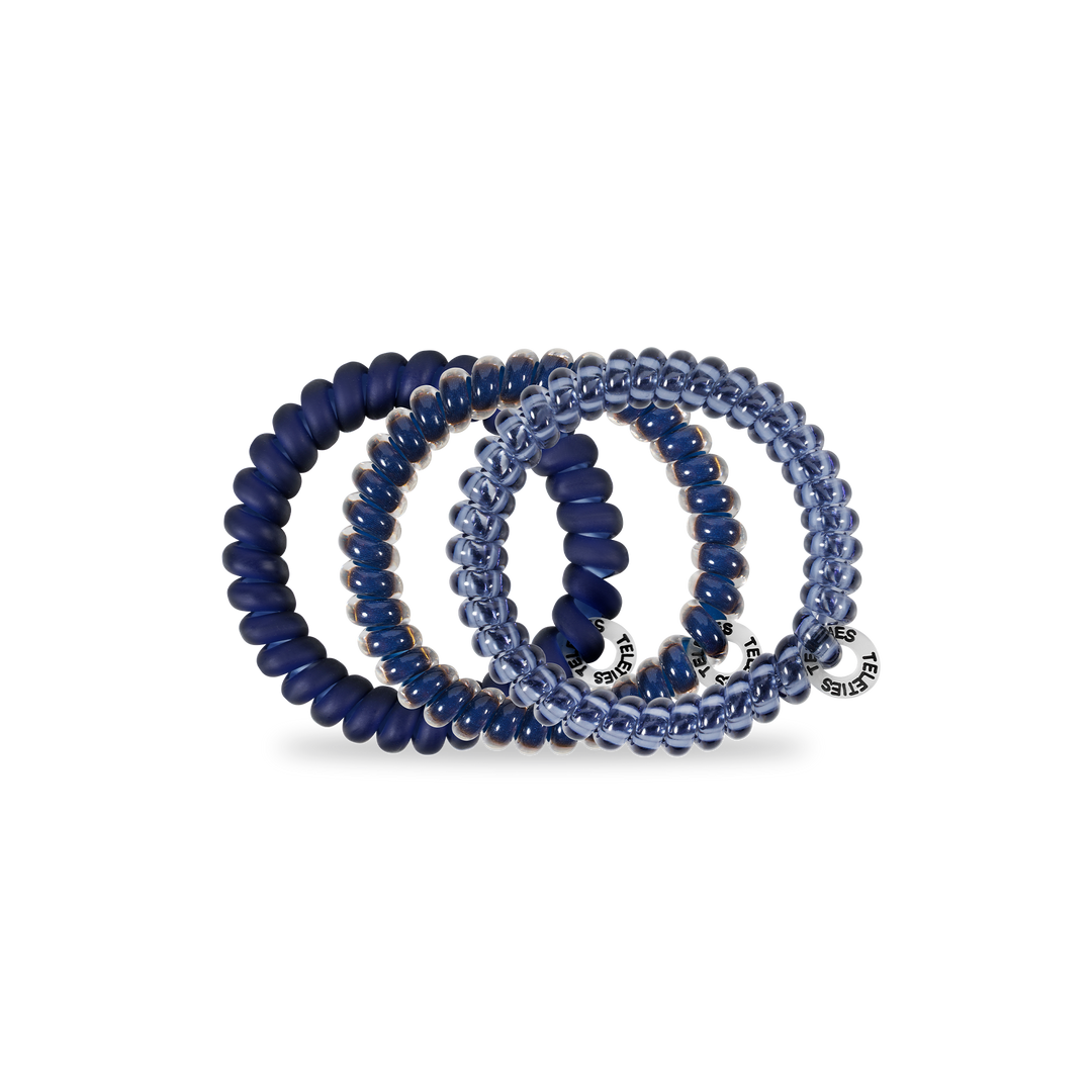 Set of four small spiral hair coils—three navy, one translucent blue, all with silver tags. Available in size Small.