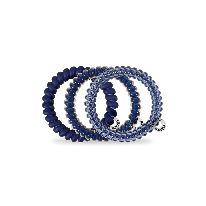 Set of four small spiral hair coils—three navy, one translucent blue, all with silver tags. Available in size Small.