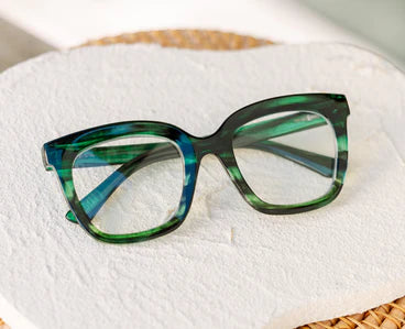 Peepers Cleo oversized square eyeglasses in green and blue marble with thick frames, UV400 protection, available in multiple sizes.