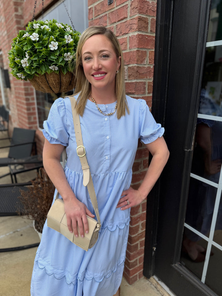 Seersucker Blue Ruffle Striped Dress with ruffle detail. Available in sizes XS–XL.