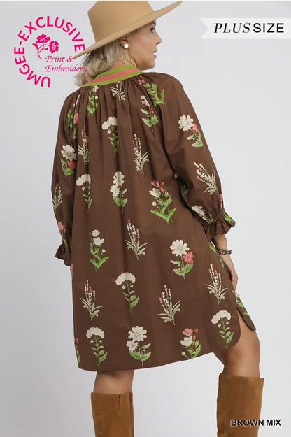 Janie Floral Tunic Dress: light brown, loose-fit, long sleeves, white and pink florals. Sizes XS–XL.