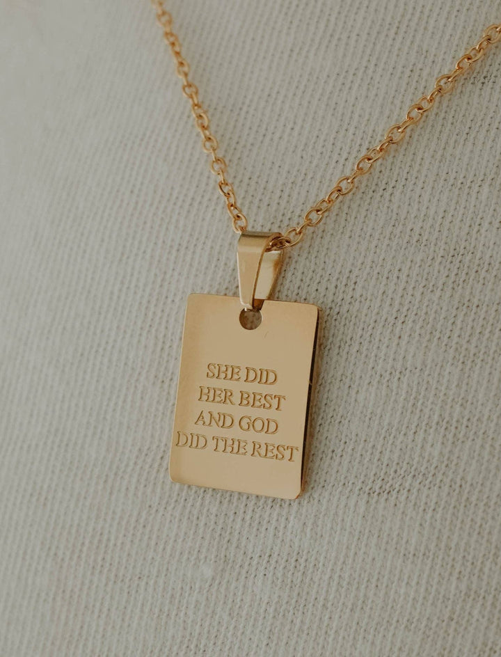 Gold rectangular pendant engraved with "SHE DID HER BEST AND GOD DID THE REST." Available in multiple sizes.