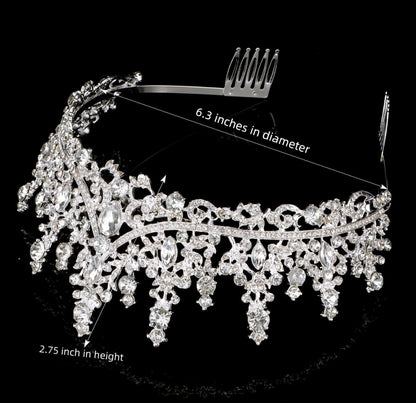 Silver tiara with clear crystals, floral and teardrop details. Size: 6.3" diameter, 2.75" tall.