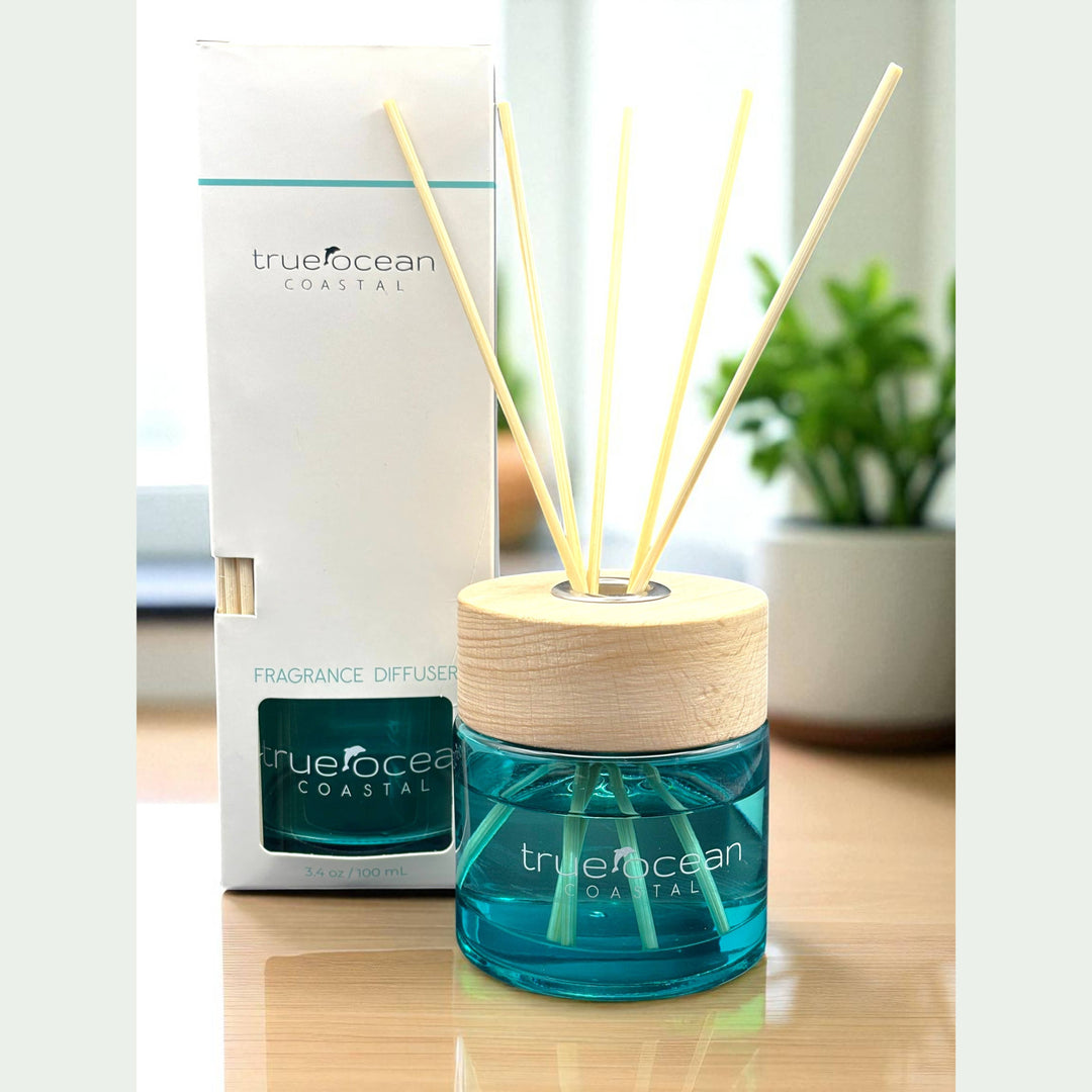 The True Ocean Reed Diffuser with blue liquid, wooden cap, and reed sticks. Available in 100ml, 200ml, and 300ml sizes.