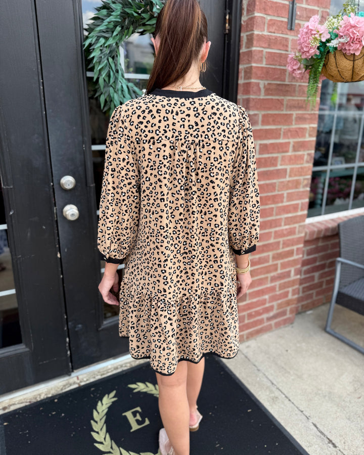 Audrey Leopard Print Smocked Dress with a relaxed silhouette, available in sizes XS-XL.