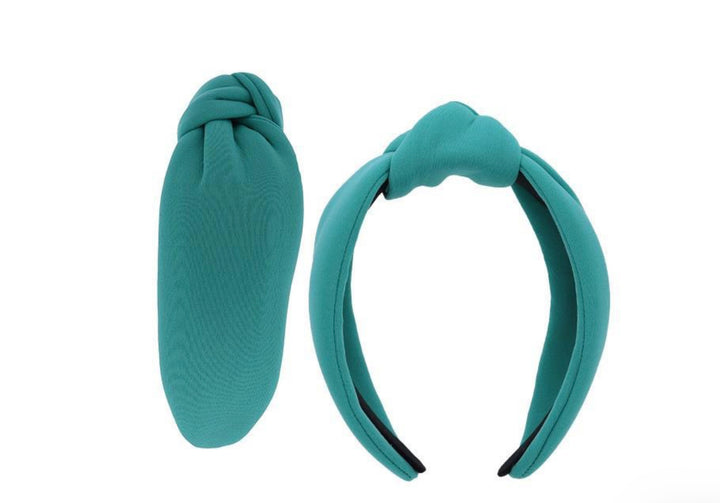Two teal fabric Knot Head Bands with stylish knot design. Available sizes: S, M, L. Shows knot detail and band width.
