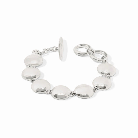 The Solara Bracelet Silver: round, flat polished discs, toggle clasp, two adjustable loops. Available in multiple sizes.