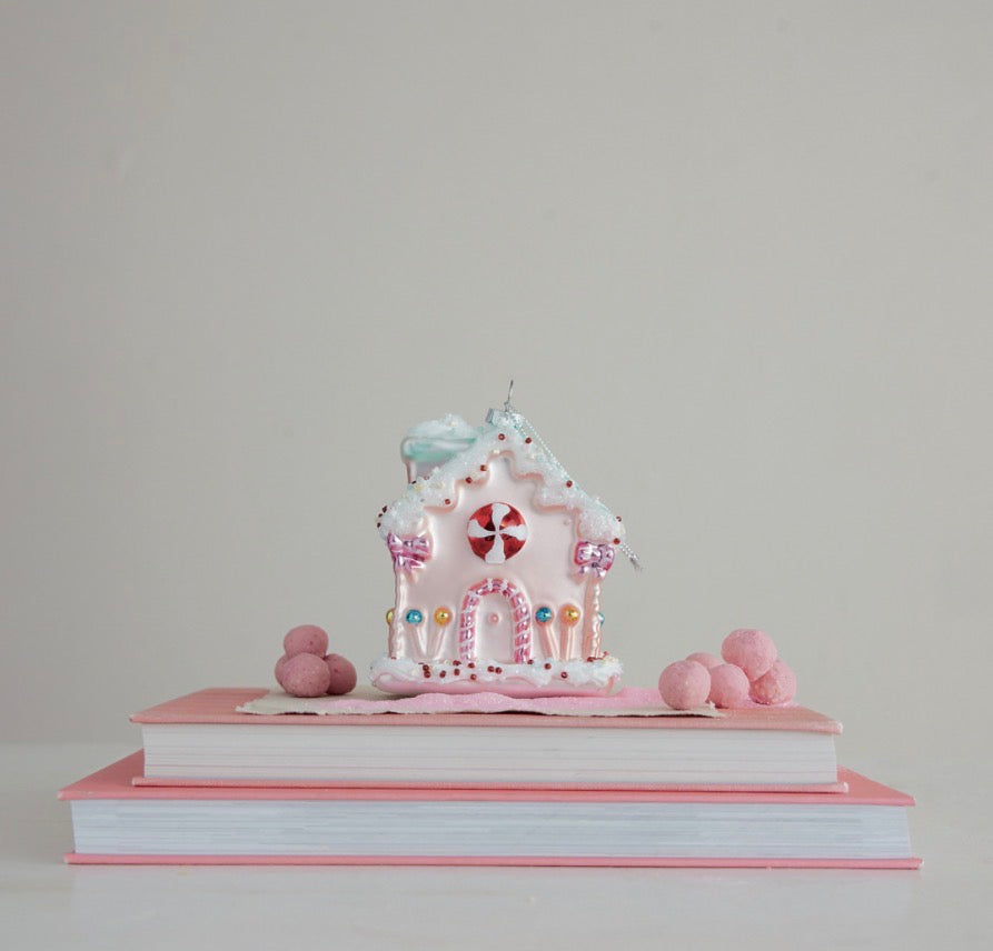 Pink gingerbread glass candy house ornament with peppermint door, frosted roof, and beaded accents.