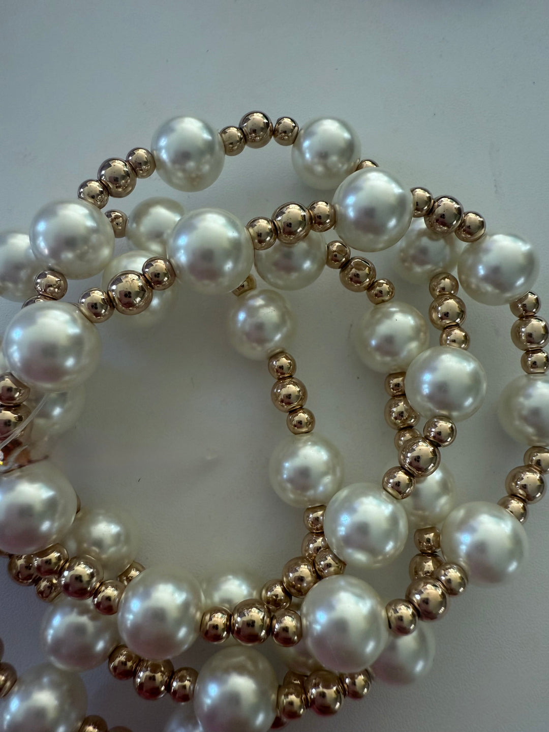 Beaded Stretch Bracelet with large white pearls and small gold beads. Available in S, M, and L sizes.