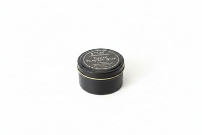 5.75 oz Wickless Candle made from coconut soy wax in a black tin with a gold rim, labeled "Toasted Pumpkin Spice.