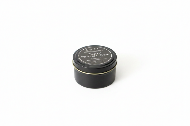 5.75 oz Wickless Candle made from coconut soy wax in a black tin with a gold rim, labeled "Toasted Pumpkin Spice.