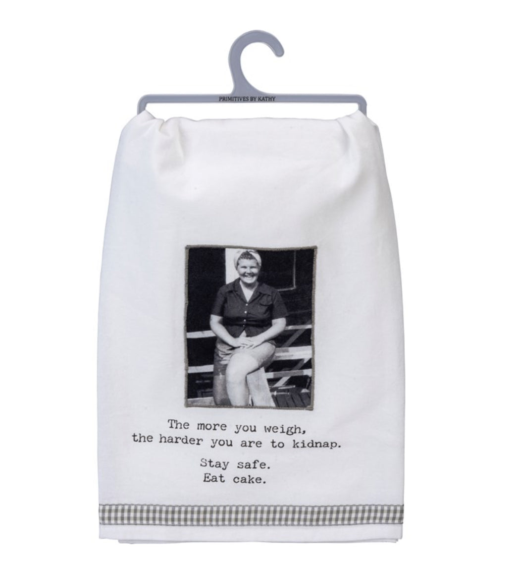 Cotton kitchen towel with humorous cake slogan. Available sizes: 16"x28", 18"x28". Black-and-white design.